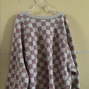 White and dull purple checker crew neck sweater with white neck and white cuffs